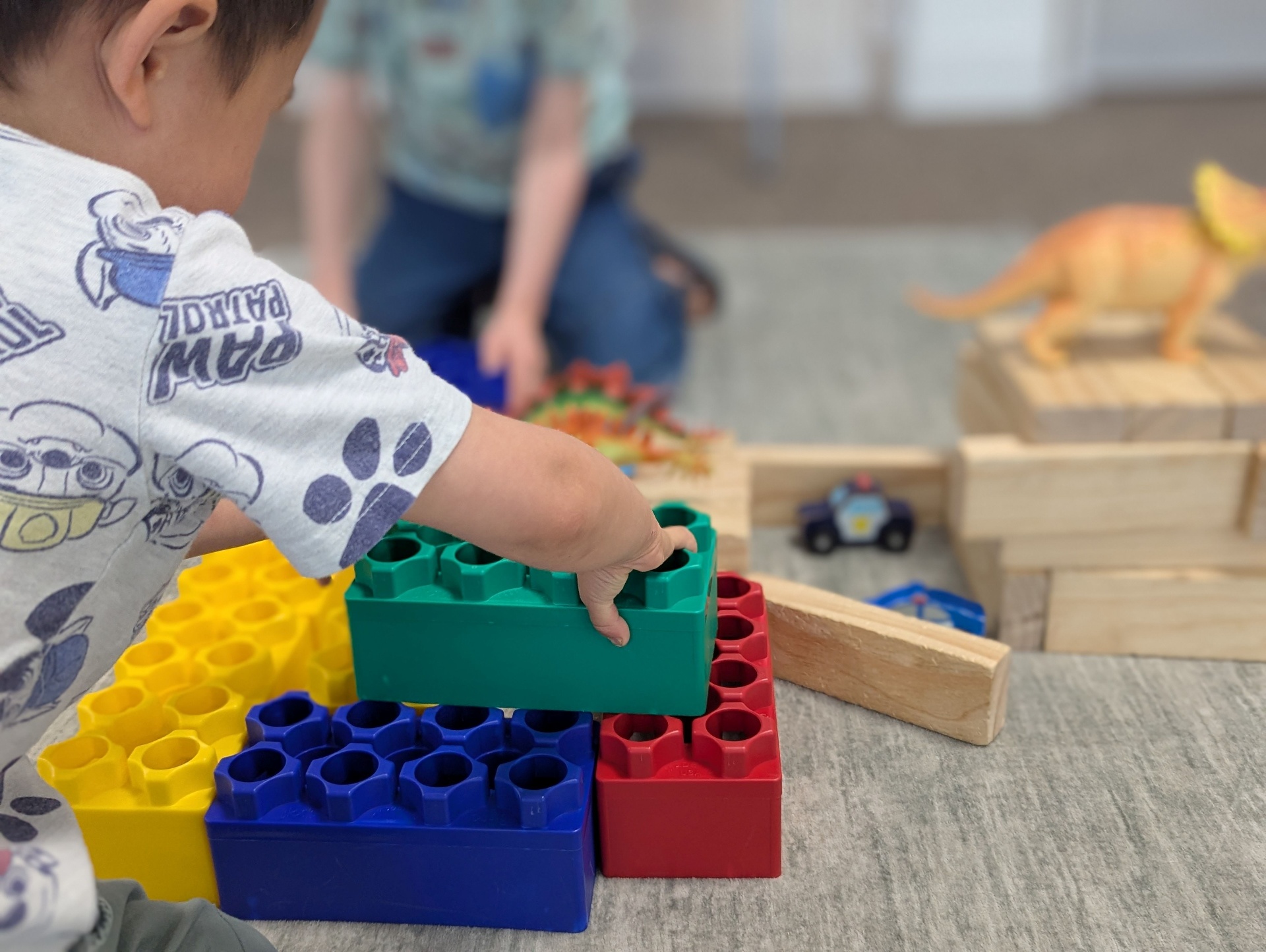 Child building with colorful blocks
